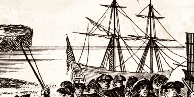 A small eighteenth-century vessel approaching an isolated English beach during a fictional nighttime smuggling operation.